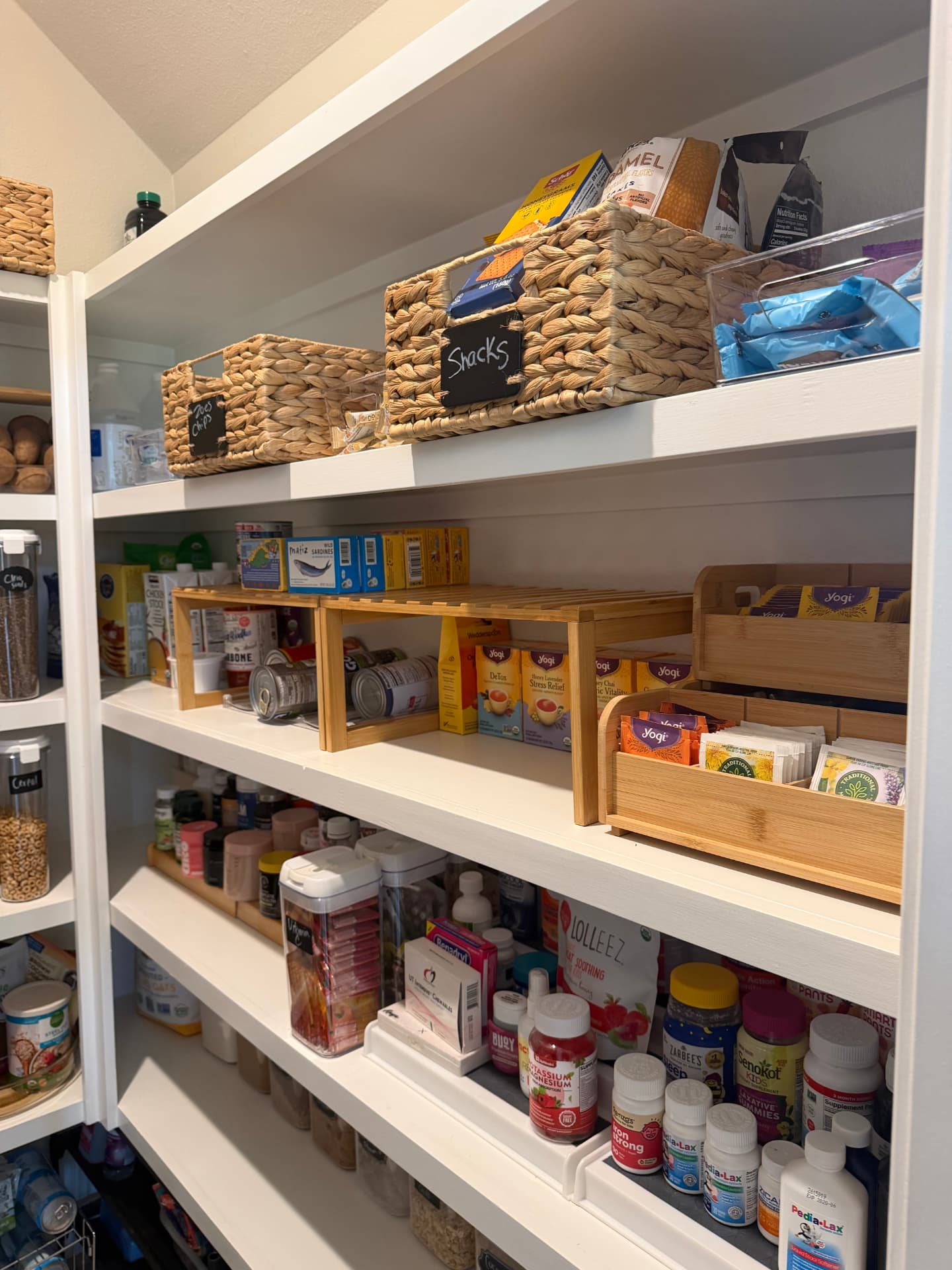 Pantry shelving with baskets and wooden food organizers