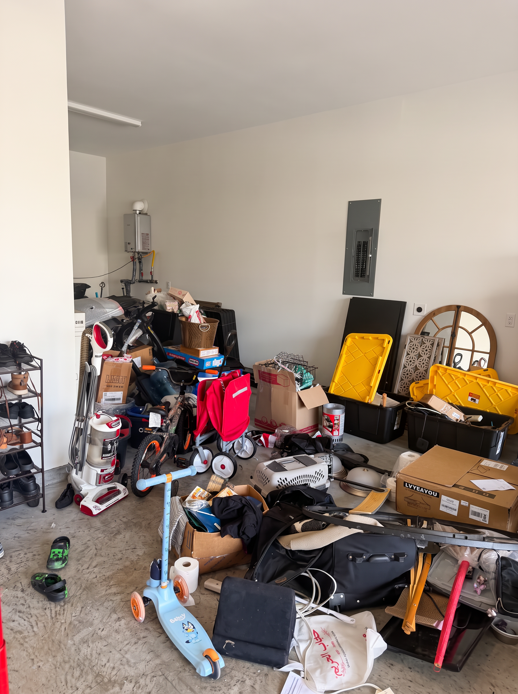 Garage containing boxes, scooters and household belongings