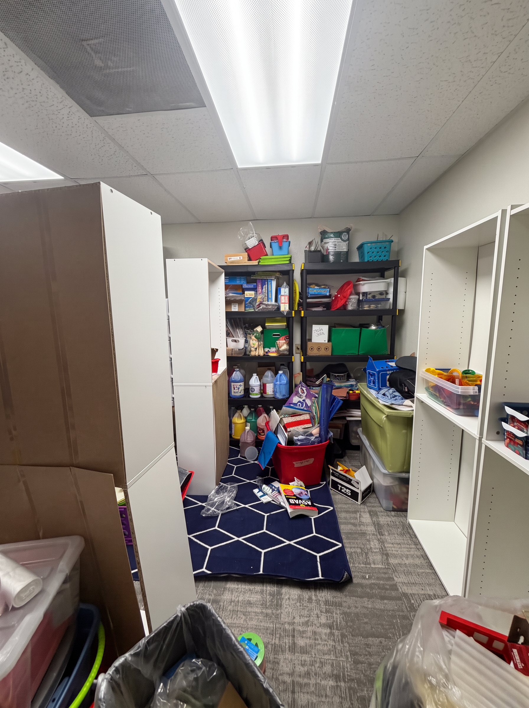 Storage room with cabinets, supplies and shelving